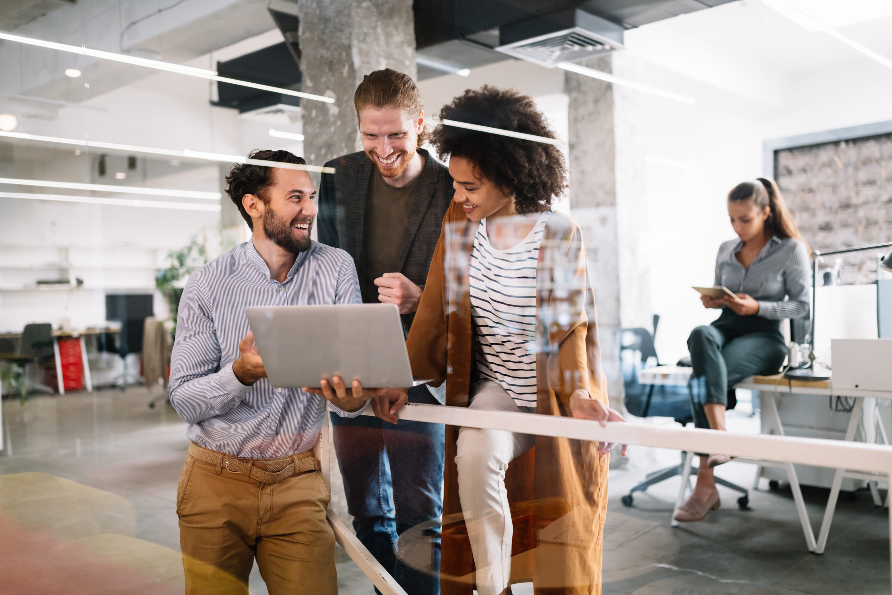 Cheerful coworkers in office during company meeting